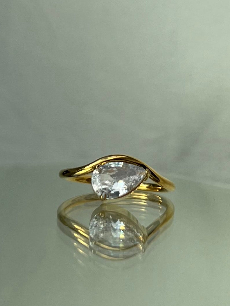 The Pear-Shaped Curved Ring